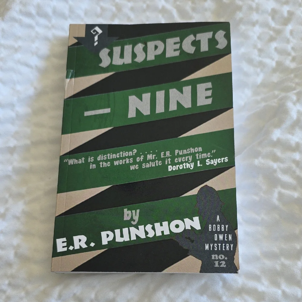 'Suspects - Nine' Green and Black Coffee Table Book